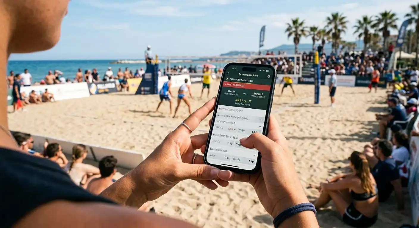 Smartphone con app di scommesse aperta durante una partita di beach volley dal vivo